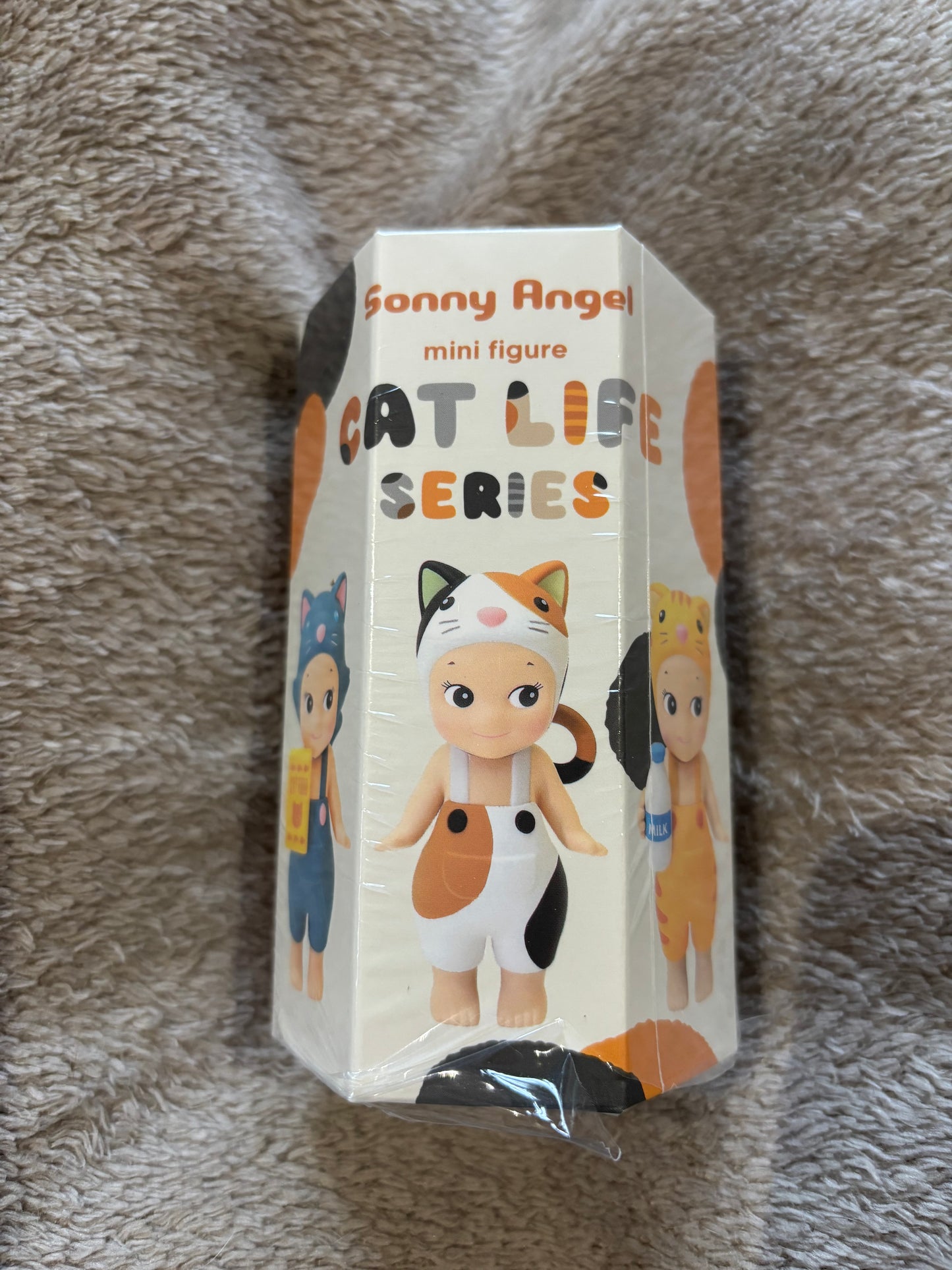 Sonny Angel Cat Life Series Blind Box resting on a grey blanket