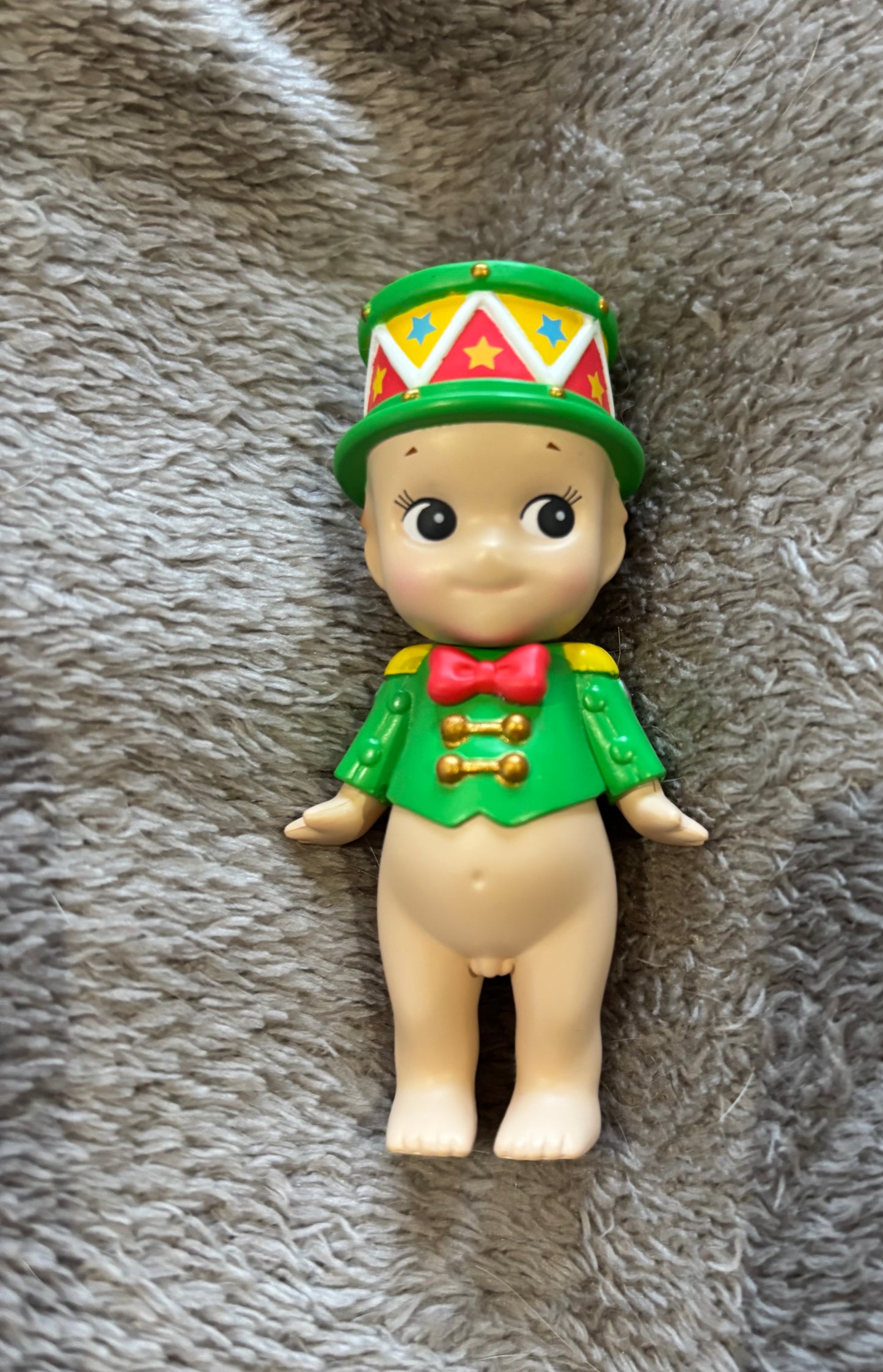 Cute Sonny Angel  mini figure doll Little Drummer Boy Christmas lying on grey blanket 