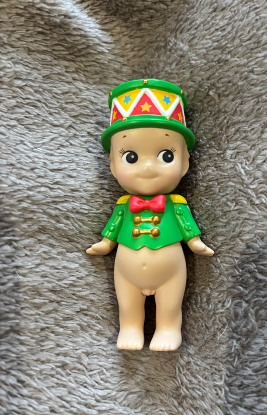 Cute Sonny Angel  mini figure doll Little Drummer Boy Christmas lying on grey blanket 