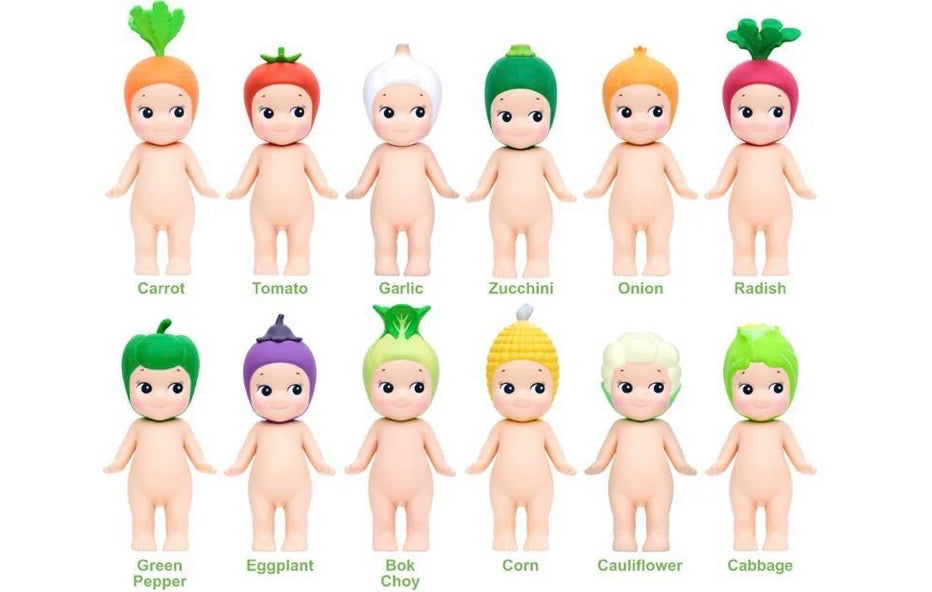 Set of toy figures resembling vegetables with corresponding vegetable names below each figure.