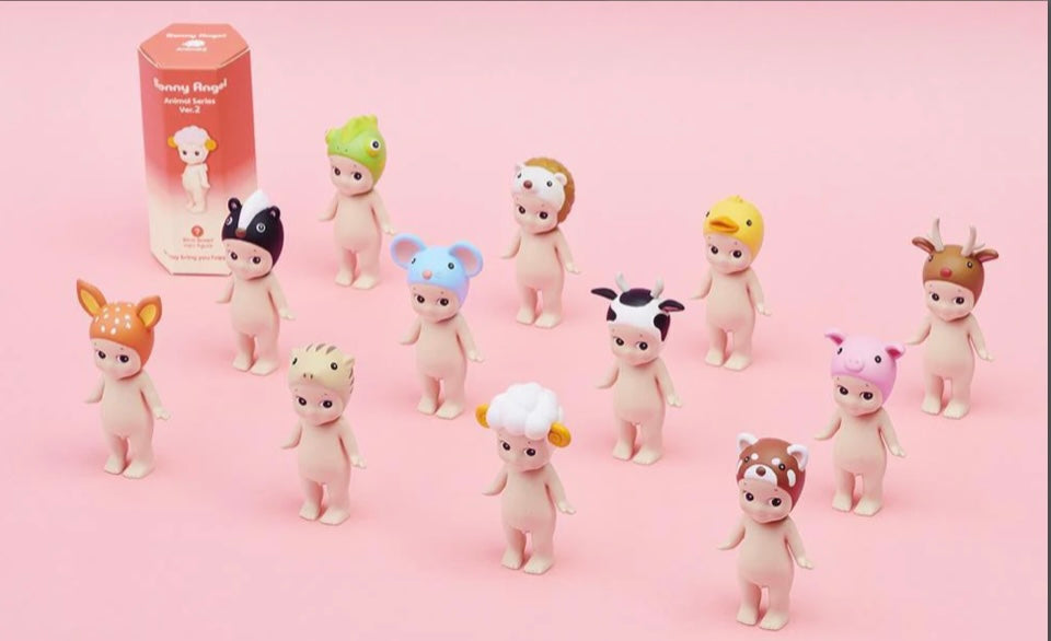 Set of small Sonny Ange blind box collectible figurines with animal head gear  on a pink background from Animal V2 series 