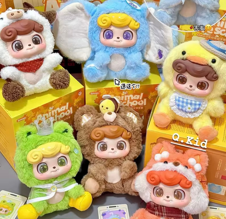 Collection of cute plush toys with cartoonish designs on a gray surface.